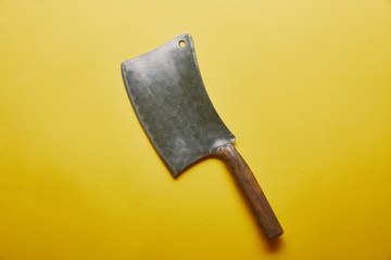 Sharp knife cleaver on yellow background