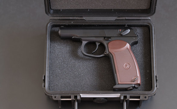 Automatic gun pistol on dark background