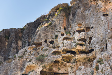 Roman tombs carved in the stone over the village of Furzol, Bekaa valley, Lebanon.