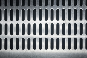 stainless steel grating with oblong holes, close up