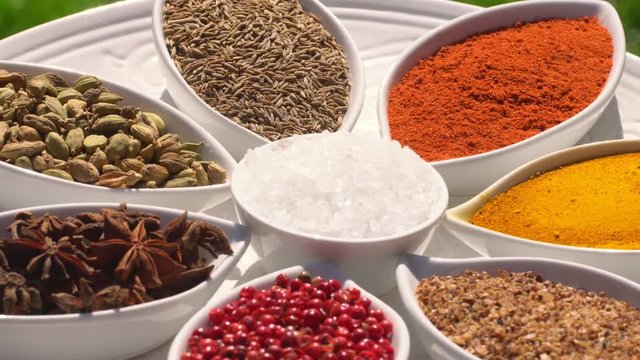 Dry spices on a rotary table. 4K. Macroshooting.