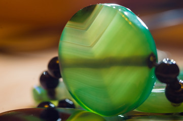 Large polished beads of beautiful translucent green agate gemstone, macro