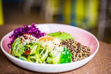 Buddha Bowl with Avocado, Tahini, Quinoa, Red Cabbage and other Healthy Vegetables