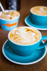 Cappuccino in Big Blue Cups in Modern Vegan Cafe