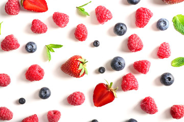 Fototapeta na wymiar Delicious ripe berries on white background, top view