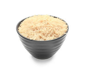 Bowl with parboiled rice on white background