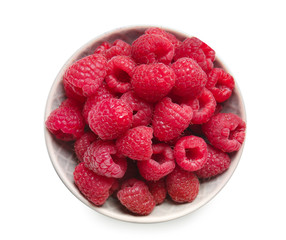 Plate with fresh ripe raspberries on white background