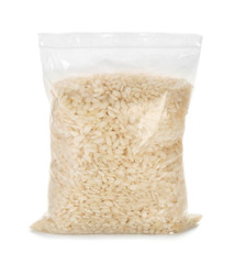 Zipper bag with raw rice on white background