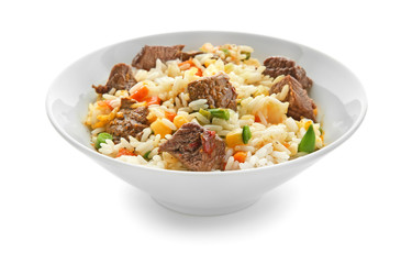 Delicious boiled rice with meat and vegetables in bowl on white background
