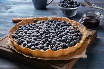 Fototapeta na wymiar Delicious blueberry pie on wooden table