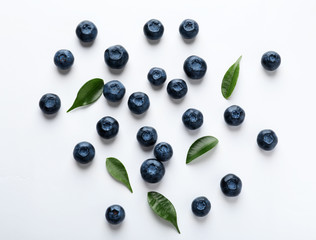 Ripe blueberries on white background