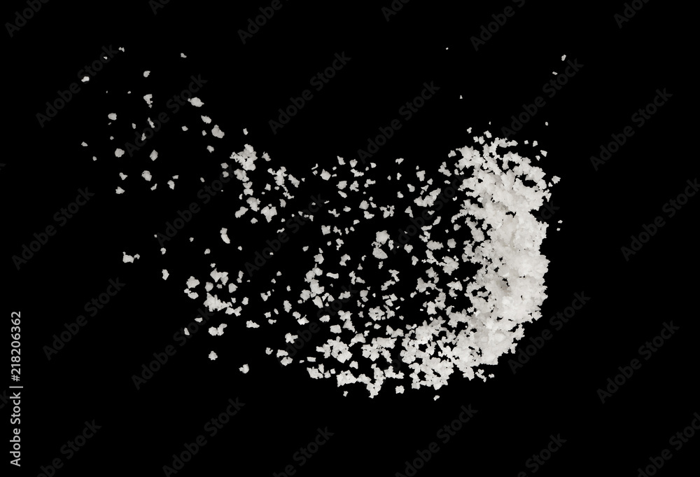 Wall mural salt splash explosion isolated on black background , freeze stop motion