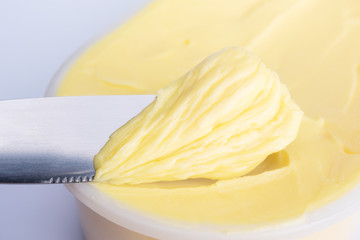 Cheese butter or margarine with knife - obrazy, fototapety, plakaty
