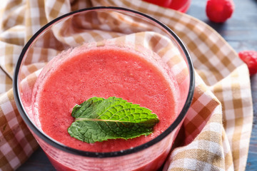 Glass of tasty raspberry smoothie, closeup