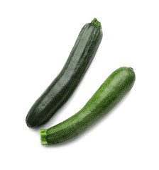 Ripe zucchinis on white background