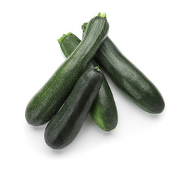 Ripe zucchinis on white background