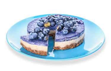 Plate with tasty blueberry cheesecake on white background