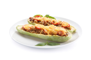 Plate with meat stuffed zucchini boats on white background