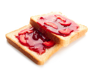 Slices of bread with delicious strawberry jam on white background