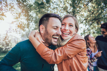 Group of young people walking through park