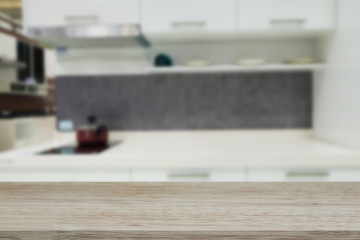 Empty wooden table and blurred kitchen background, can be used for display or montage your products