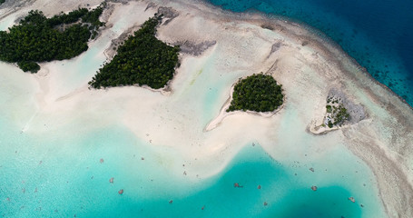 small islands (motu) in the middle of a lagoon in aerial view, French Polynesia