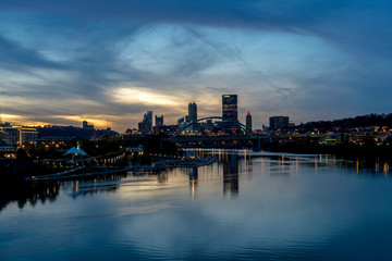 The city of Pittsburgh at sunset with clouds taken above the Ohio River