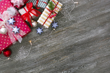 Fototapeta na wymiar Beautiful Christmas gifts on wooden background