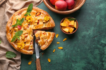 Composition with tasty homemade peach pie on table