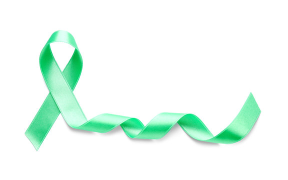 Green satin ribbon on white background. Kidneys cancer awareness concept