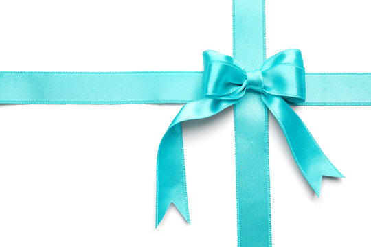 Turquoise satin ribbons with bow on white background