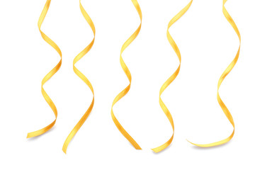 Golden satin ribbons on white background