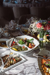 wedding or other festive table with different dishes