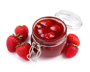Glass jar with delicious strawberry jam on white background