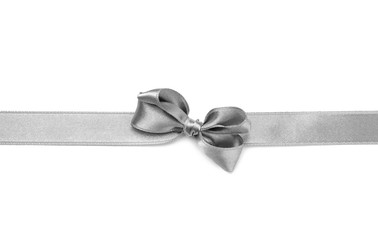 Fototapeta premium Silver ribbon with bow on white background