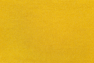 Gold color cotton knitted textile as background