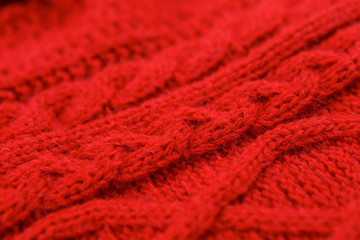 Close-up red cotton knitted textile with pattern as background