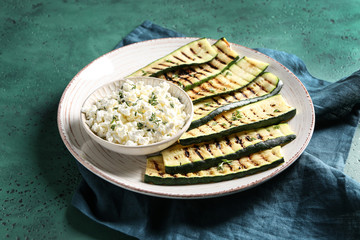 Tasty grilled zucchini with cottage cheese on plate