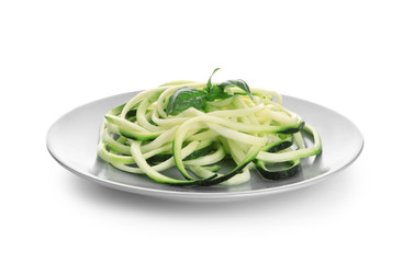 Plate with zucchini spaghetti isolated on white