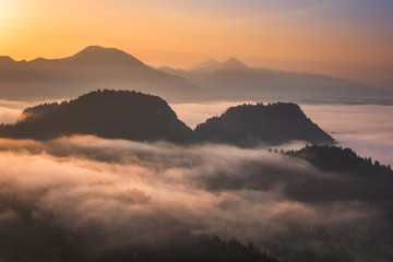 Sunrise over the Alps mountains at foggy morning in Bled, Slovenia
