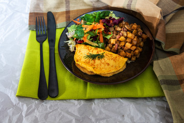 French Omelette with Potatoes, Mushroom and Salad