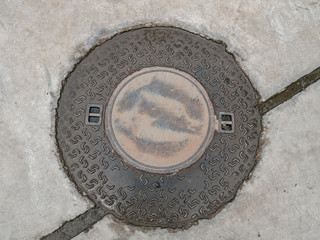 round drainage cover on concrete floor