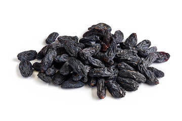Heap of black raisins isolated on white background.