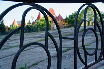 Steel fence in public park, defocused background