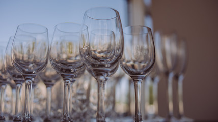 Crystal clear empty wine glasses on the table. Alcohol background. 