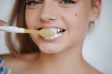 Woman smile. Teeth whitening. Dental care. Happy young woman brushing teeth.