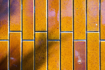 A view of porcelain ceramic tiles in orange color 