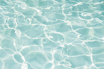 Texture of water in swimming pool for background