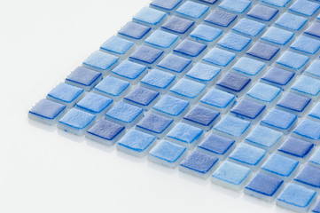 little blue ceramic tile on a white background, majolica. for the catalog