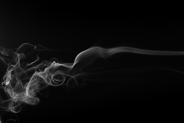 Movement of white smoke on black background
